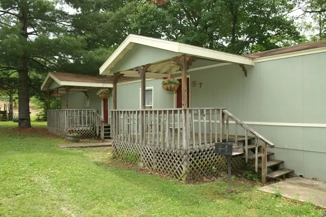 A house with a porch and a deck.