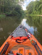 A kayak is shown from the bow of it.