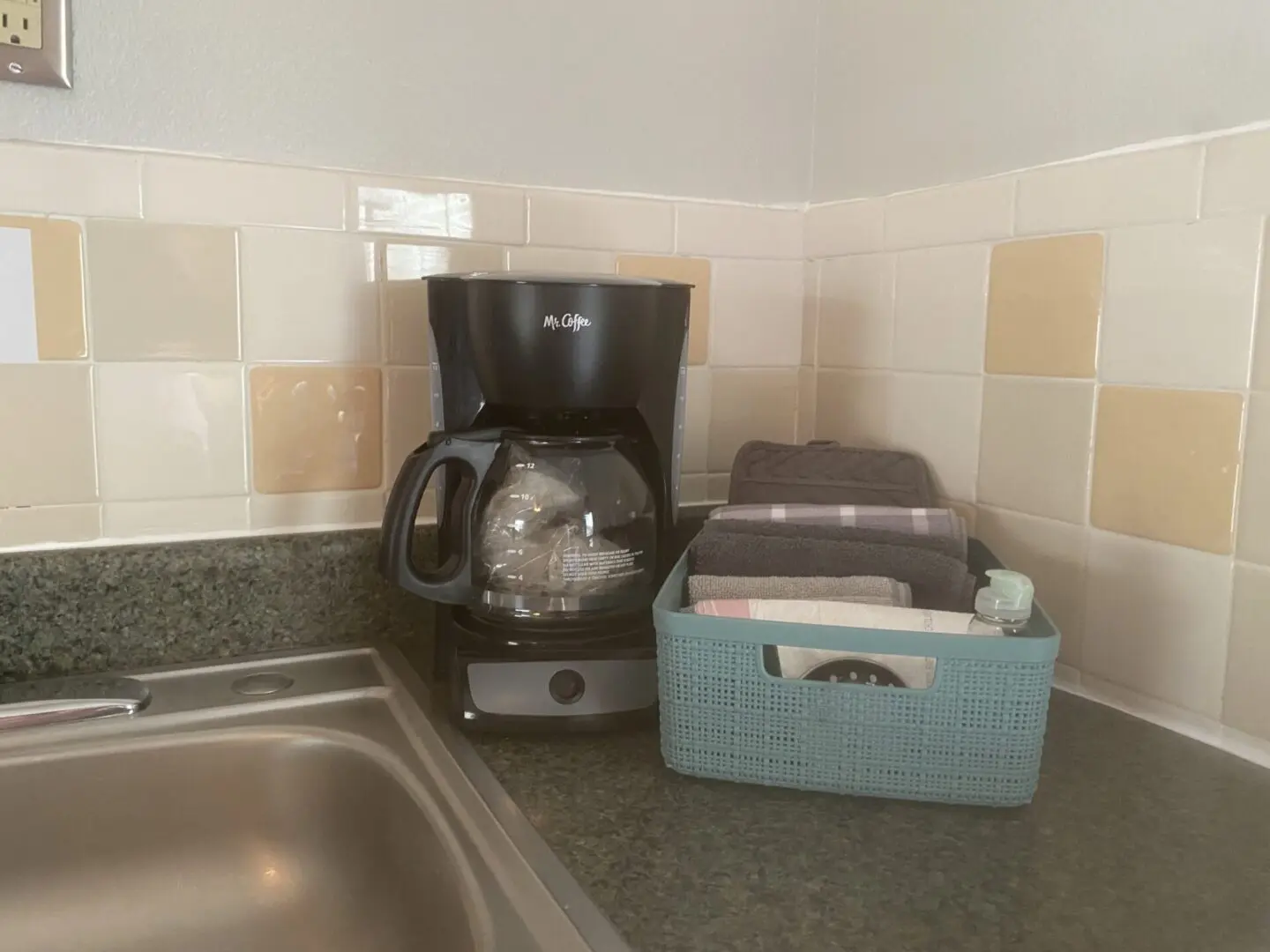 A coffee maker sitting on top of a counter.