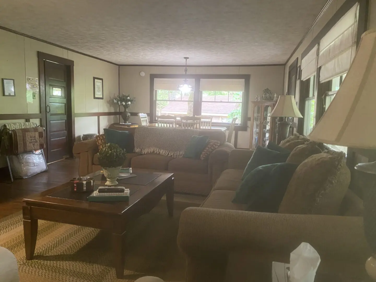 A living room with couches and tables in it