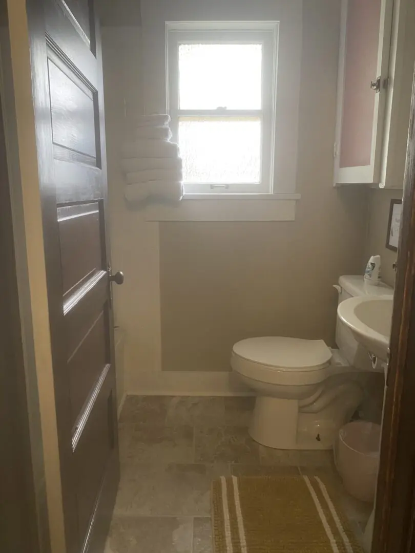 A bathroom with a toilet and sink in it