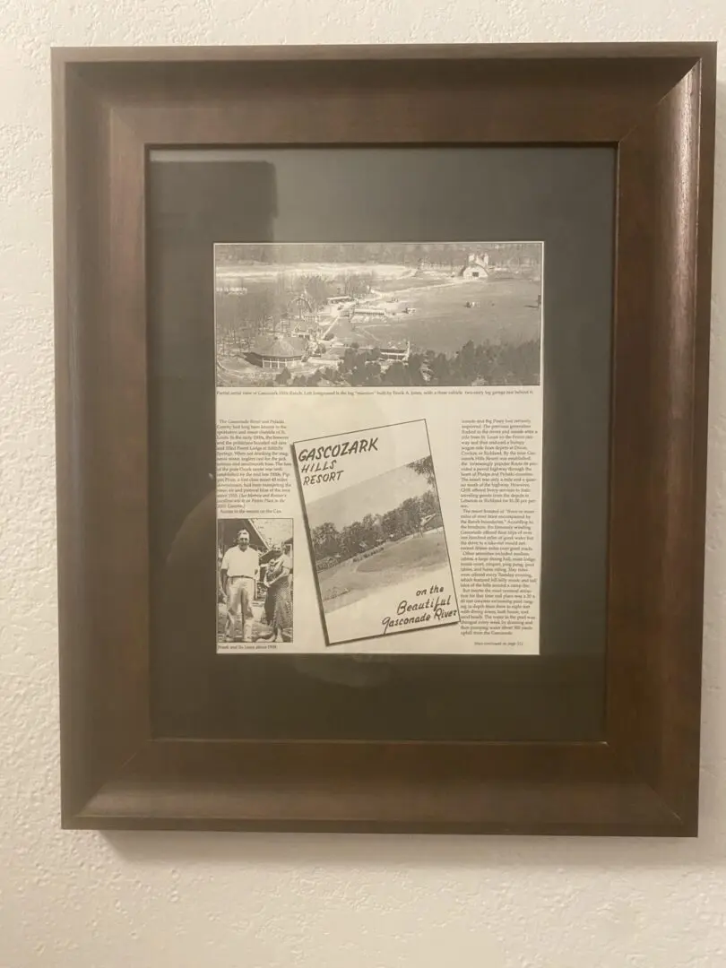 A framed newspaper and picture of the old town.
