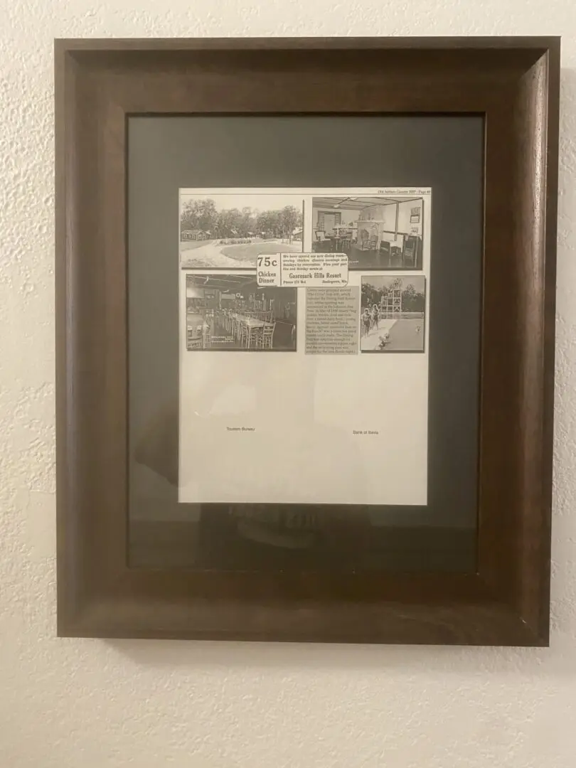 A picture of the back wall of a room with a frame.