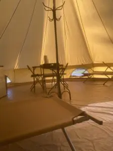 A tent with tables and chairs in it