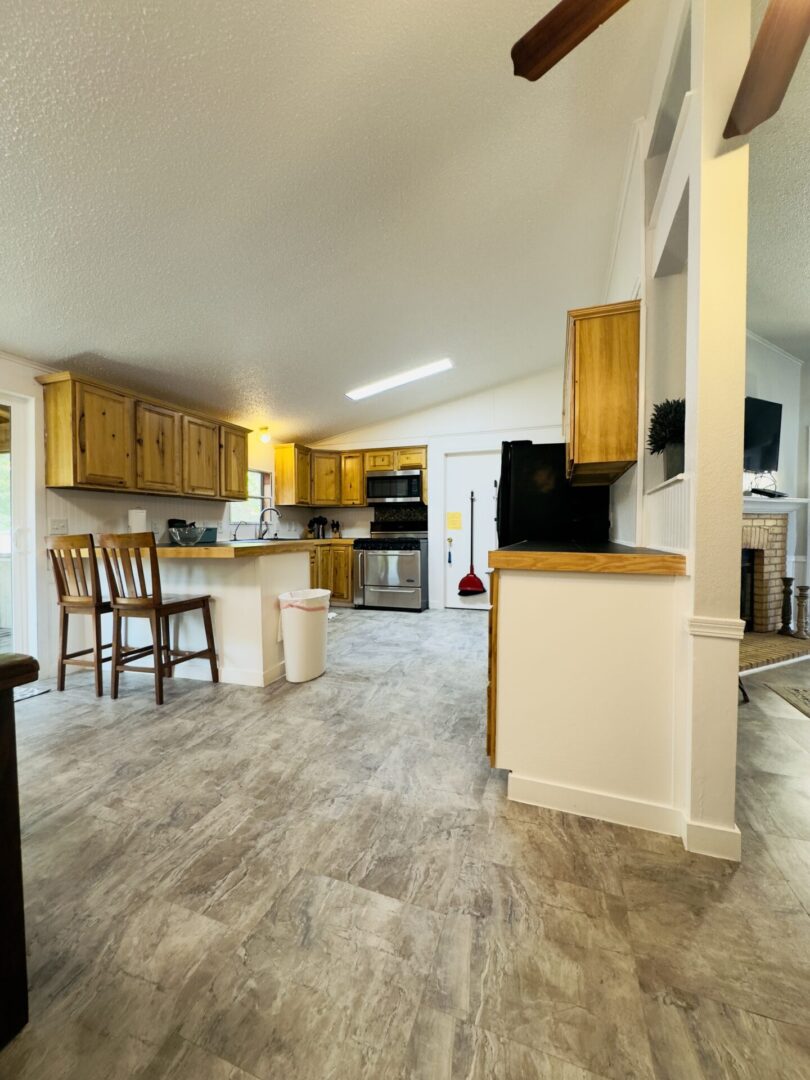 Modern kitchen with wooden cabinets and island.